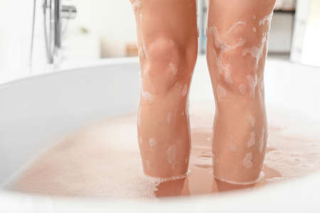 Legs of beautiful young woman in bathtubの写真素材