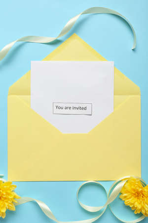 Invitation with envelope on color background