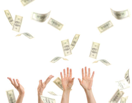 Female hands with falling dollar banknotes on white background