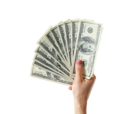 Female hand with dollar banknotes on white background