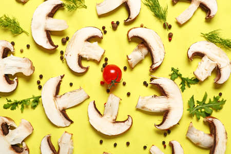 Composition with fresh champignon mushrooms, herbs and spices on color background