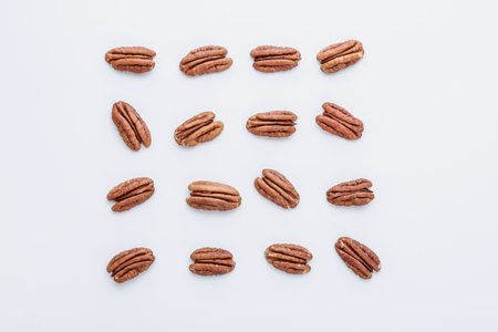 Tasty pecan nuts on white backgroundの写真素材