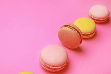 Different tasty macarons on color backgroundの写真素材