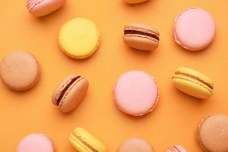Different tasty macarons on color backgroundの写真素材