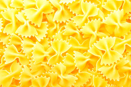 Tasty uncooked pasta as backgroundの写真素材