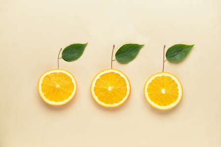 Composition with fresh orange slices on light backgroundの写真素材