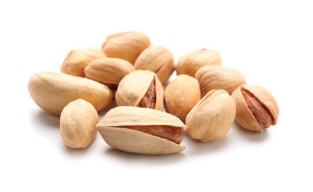 Tasty pistachio nuts isolated on whiteの写真素材