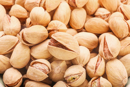 Tasty pistachio nuts as backgroundの写真素材