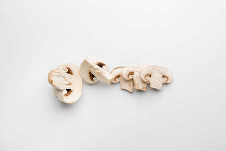 Pieces of fresh mushrooms on white backgroundの写真素材