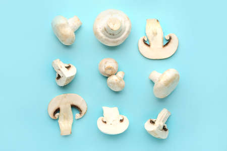 Fresh mushrooms on color backgroundの写真素材
