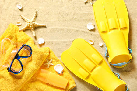 Set of beach accessories on sandの写真素材