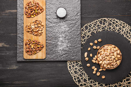 Composition with tasty pistachio nuts on table