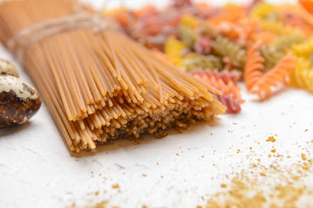 Uncooked pasta on white background, closeupの写真素材