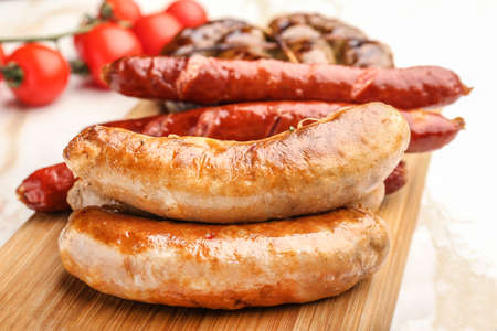 Tasty grilled sausages wooden board, closeupの写真素材