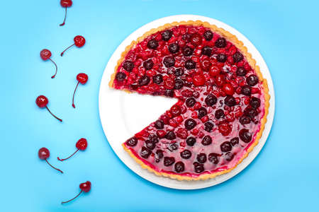 Tasty cherry pie on color background
