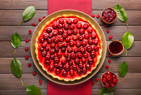 Tasty cherry pie on wooden tableの写真素材