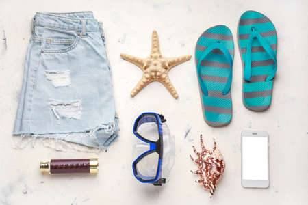 Composition with beach accessories on light backgroundの写真素材