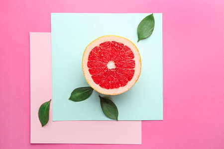 Fresh cut grapefruit on color background