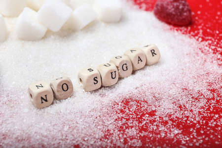 Cubes forming text NO SUGAR on color background