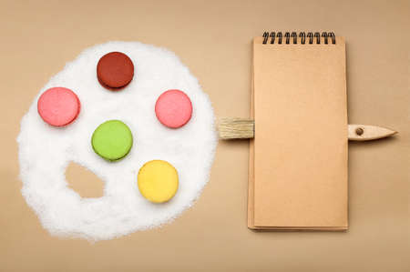 Composition with painter's palette made of sweets on color backgroundの写真素材