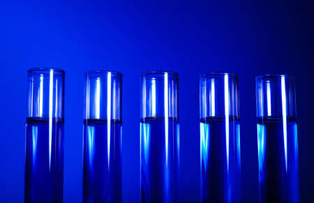 Test tubes with samples on color backgroundの写真素材