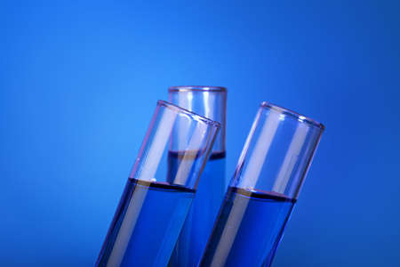 Test tubes with samples on color backgroundの写真素材