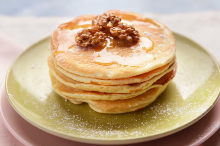 Plate with tasty sweet pancakes on table, closeupの写真素材