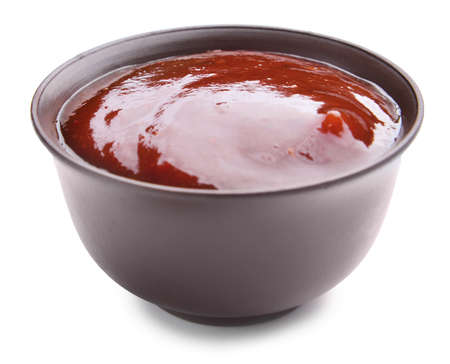 Bowl with tasty barbecue sauce on white backgroundの写真素材