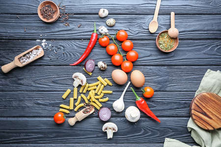 Christmas tree shape made of products on dark backgroundの写真素材