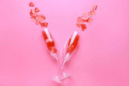 Glasses with hearts on color background. Valentine's day celebrationの写真素材