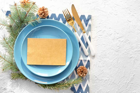 Beautiful table setting for Christmas dinner on white background