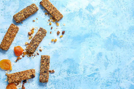 Tasty granola bars on color backgroundの写真素材