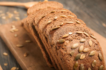 Slices of fresh bread on board, closeup