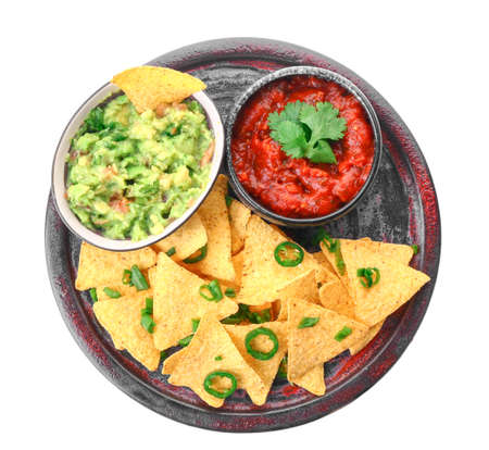Plate with tasty nachos and sauces on white backgroundの写真素材