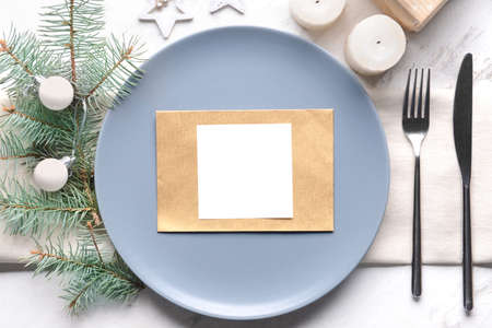 Beautiful table setting for Christmas dinner on white background