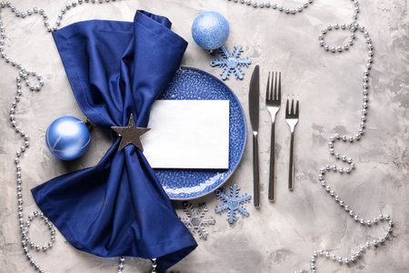 Beautiful table setting for Christmas dinner on grunge backgroundの写真素材