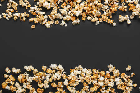 Tasty popcorn on dark backgroundの写真素材