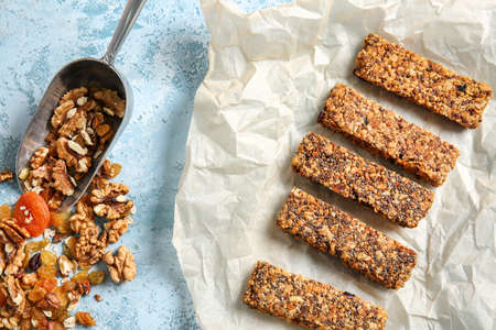 Tasty granola and bars on tableの写真素材