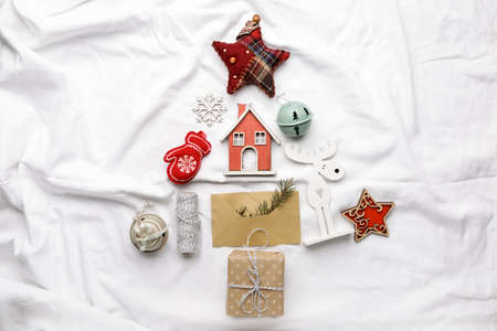 Beautiful Christmas tree made of decor on white clothの写真素材