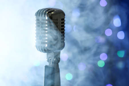 Retro microphone with smoke against defocused lightsの写真素材