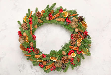 Beautiful Christmas wreath on light backgroundの写真素材