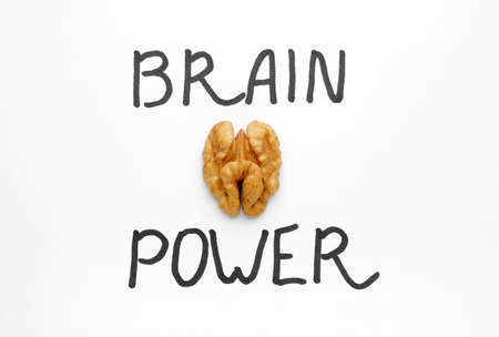 Tasty walnut with text BRAIN POWER on white background