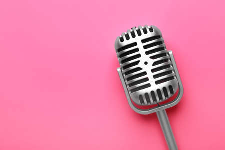 Retro microphone on color backgroundの写真素材