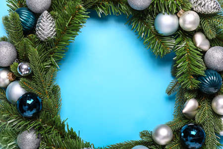 Beautiful Christmas wreath on color backgroundの写真素材