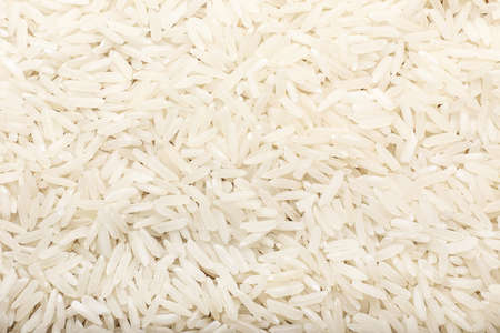 Heap of raw rice as backgroundの写真素材