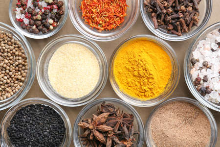 Bowls with different spices on tableの写真素材
