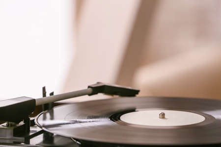 Record player with vinyl disc in room, closeupの写真素材