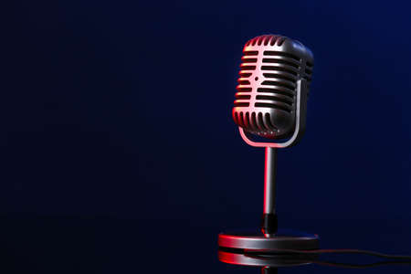 Retro microphone on dark color backgroundの写真素材