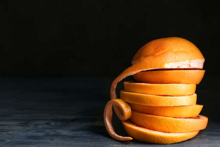Fresh cut grapefruit on dark backgroundの写真素材
