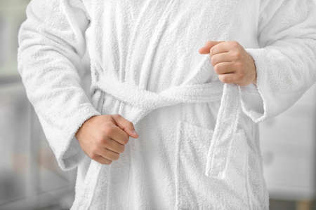 Handsome young man in bathrobe, closeup
